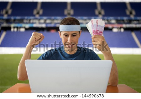 man betting  online and making a lot of euros in stadium