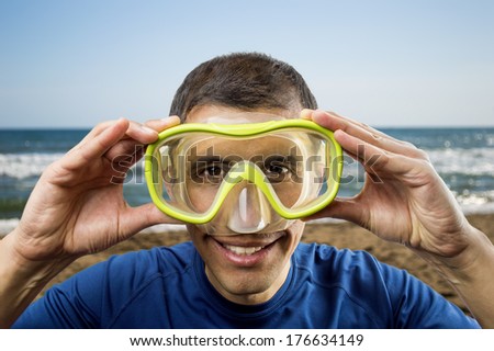 man getting ready for holiday activity scuba diving