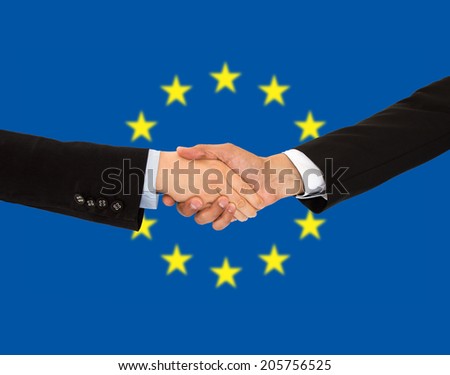 handshake of a woman and business men in europe