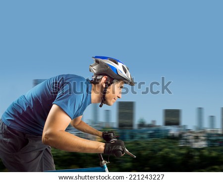 close up of sporty man cycling at city background