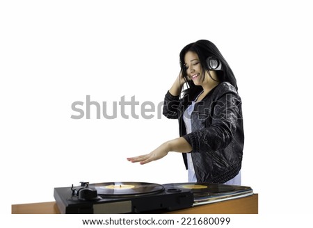 female DJ spinning records in headphones with white background