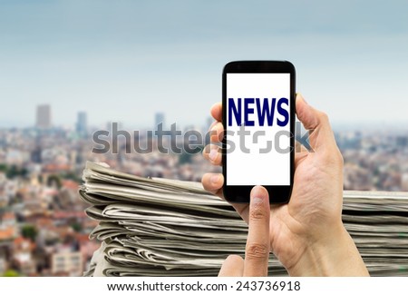 closeup of group of newspapers online in telephone on a city background