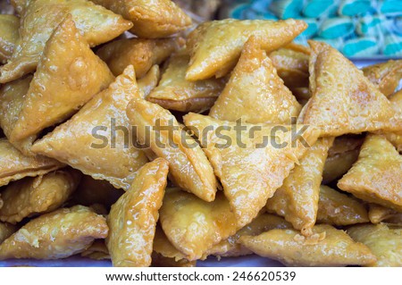 group of arab pastries with honey at a street vendor