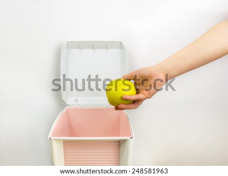 anorexic woman throwing food at garbage