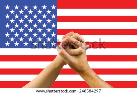 a woman and a man in his hands with a flag of USA background in concept of unity