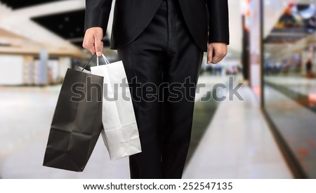 close up of business man shopping in a mall