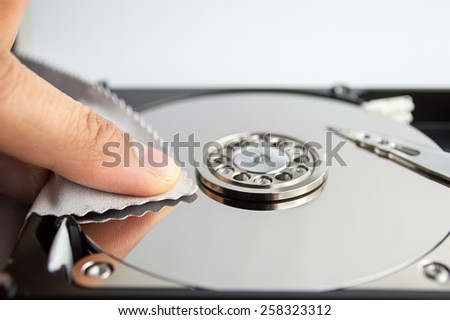 hand cleaning hard disk with cloth