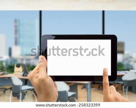 Businessman surfing of a digital tablet at the office