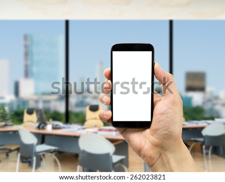 Businessman surfing with one smartphone at the office