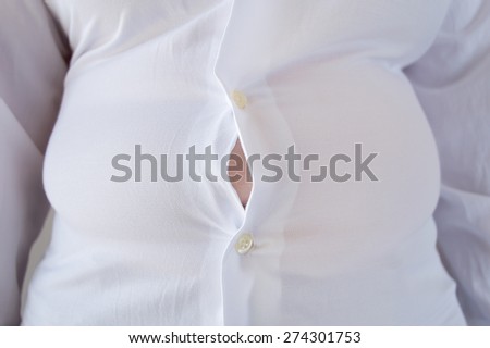close up of a woman with little shirt for being fat