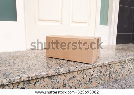 carton box on the floor of entry of the  house