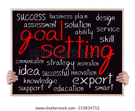 goal setting and other related words handwritten on blackboard with hands goal setting and other related words handwritten on blackboard with hands