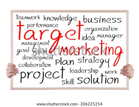 target marketing and other related words handwritten on whiteboard with hands