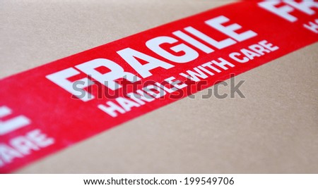 Fragile red label on a moving box