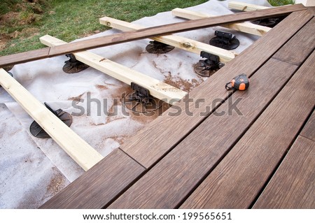 Construction of a wooden terrace in a garden