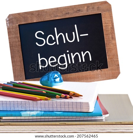Vintage backboard schul beginn, meaning back to school in German, and school supplies isolated on white background
