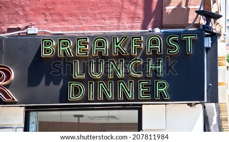 Restaurant neon sign breakfast lunch dinner in New York USA