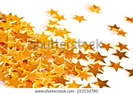 Close up of golden stars on a white background