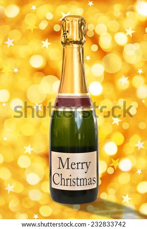 Merry Christmas on a label of a bottle of Champagne, shiny golden background