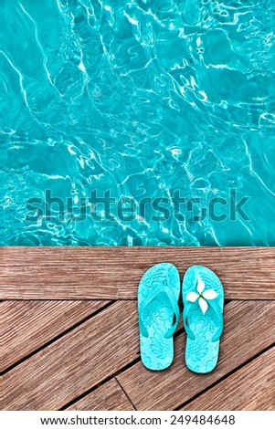 Blue flip flops on a wooden deck