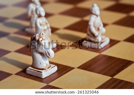 Close up of white chinese chess pieces