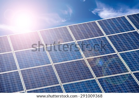 Blue solar cells, blue sky and sun halo