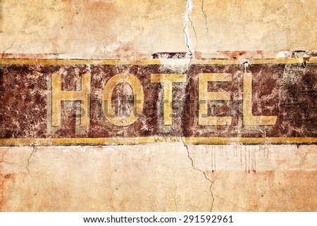 Old vintage hotel sign, painted on a wall
