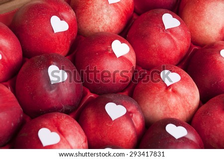 Crate of nectarine with heart shaped blank labels