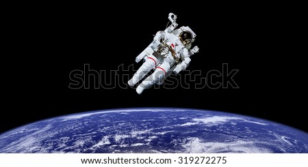 Astronaut in outer space over the planet earth. \
This image is a collage of different images furnished by NASA