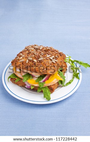 Wholegrain sandwich with seeds, vegetables and chicken