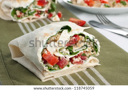 Vegetarian wrap sandwich with quinoa, tomato and red pepper