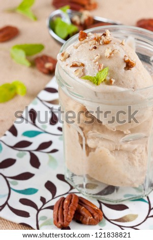 Banana ice cream  with nuts and mint, selective focus, shallow depth of field