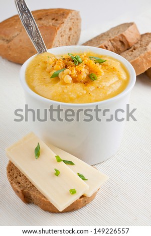 Bowl of lentil soup and bread with cheese for lunch