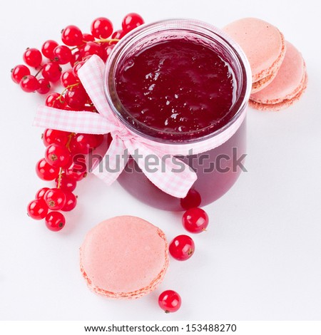 Red currant, sweet jelly and pink macaroons shot from above