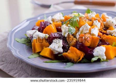Grilled pumpkin and beet salad with arugula and feta