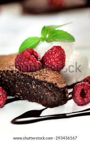 Chocolate brownie with raspberry close up
