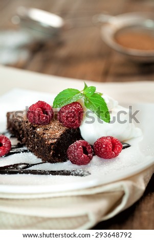 Chocolate brownie  with raspberry and mint