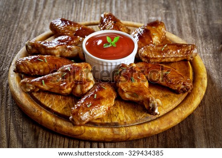 Buffalo Chicken Wings on wooden plate