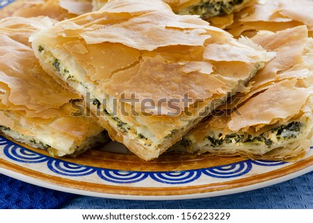 Spanakopita, Greek spinach pie with feta cheese and filo party on on plate