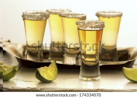 Group of Ripasso tequila shots with limes and salt