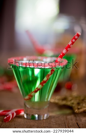 Christmas emerald green cocktail, glass rimmed with crushed candy cane. Great drink for entertaining.