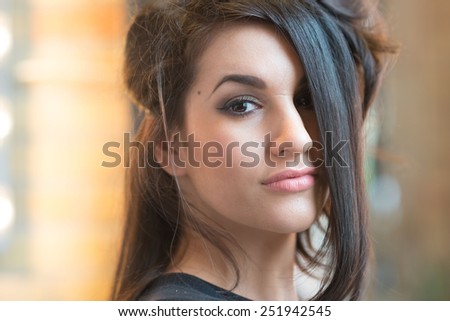 Young woman getting her hair done in a trendy hair salon