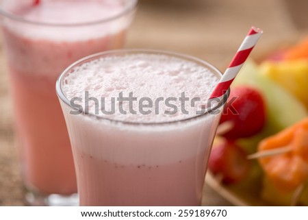 Strawberry smoothies and  fruit kabobs - fruit on skewers - on tray