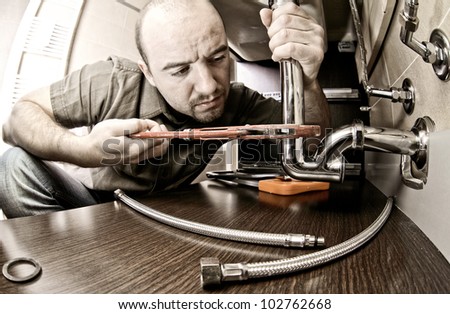 portrait of caucasian plumber at work