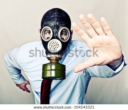 portrait of man with gas mask running pose