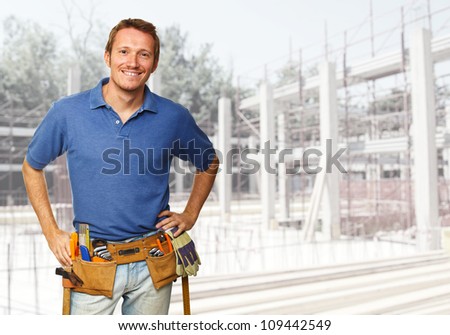 smiling handyman at construction site