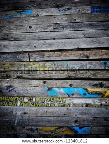 wood dirty board and graffiti text