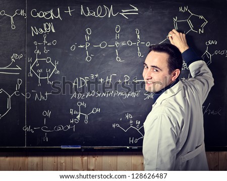 portrait of teacher with blackboard background
