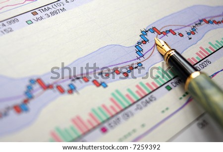 Hi res photo of financial stat with pen