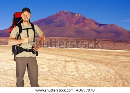 young backpacker travel alone in the desert